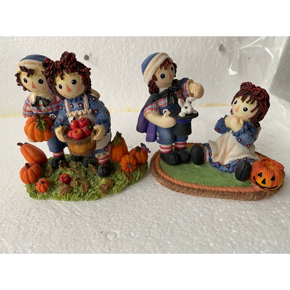 collectible figurines are Enesco Raggedy Ann and Andy Harvest and Halloween